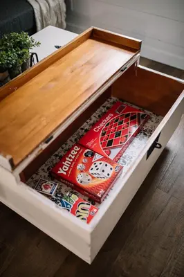 a wooden drawer with a magazine inside of it at Cozy Cottage on 250 Acre Dairy Farm Near Ark in Dry Ridge