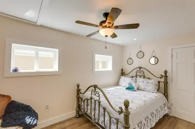 a bedroom with a bed with a ceiling fan at Historic Madison Retreat - 1 Mi to Ohio River in Madison