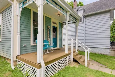 a front porch of a house with a wooden deck at Historic Madison Retreat - 1 Mi to Ohio River in Madison