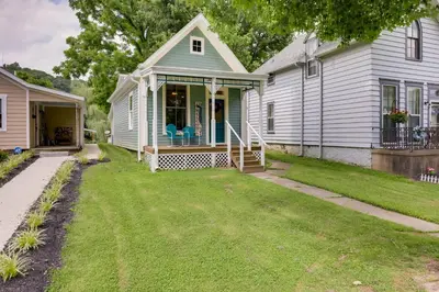 a white house with a porch and a yard at Historic Madison Retreat - 1 Mi to Ohio River in Madison