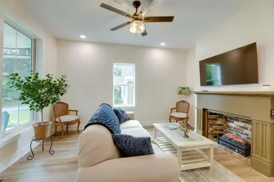 a living room with a couch and a fireplace at Historic Madison Retreat - 1 Mi to Ohio River in Madison