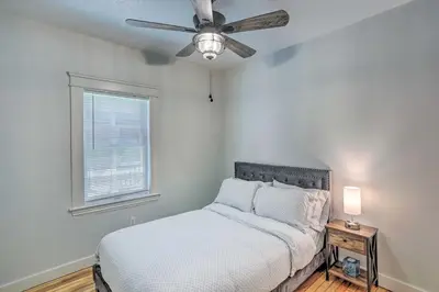 a bedroom with a bed and a ceiling fan at 3 Mi to Dtwn Walkable Apt in Cleveland! in Cleveland