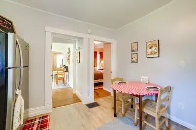 a kitchen and dining room with a table and a refrigerator at BBQ, Fire Pit and Yard Family Home in Adrian in Adrian
