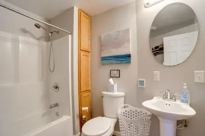 a bathroom with a toilet and a sink and a mirror at BBQ, Fire Pit and Yard Family Home in Adrian in Adrian