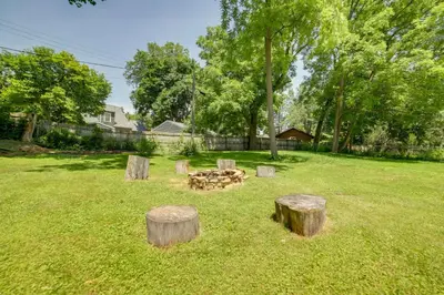 a fire pit in a yard with tree stumps at BBQ, Fire Pit and Yard Family Home in Adrian in Adrian