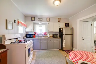 a kitchen with a stove and a refrigerator at BBQ, Fire Pit and Yard Family Home in Adrian in Adrian