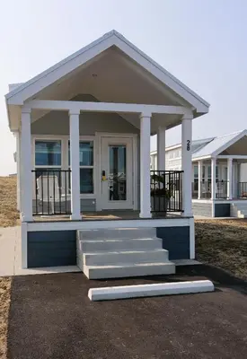 a small house with a front porch and stairs at Bayfront Resort at Cross View Site #28 in Sandusky
