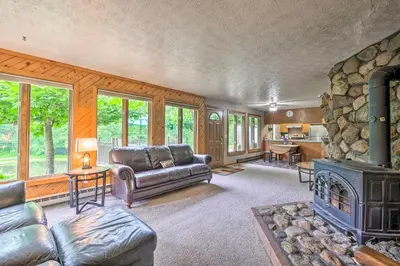 a living room with a couch and a fireplace at Mimis Place about Ohio Countryside Duplex with Deck in Orrville