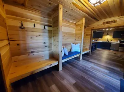 a sauna with a bench in a wooden cabin at Luxury Cabin w/ Game Room & Hot Tub at Cave Run Lake in Wellington