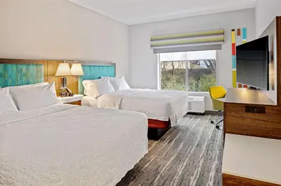 a hotel room with two beds and a flat screen tv at Hampton Inn & Suites Cincinnati West, Oh in Dent