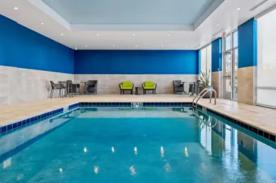a pool in a hotel room with blue walls at Hampton Inn & Suites Cincinnati West, Oh in Dent