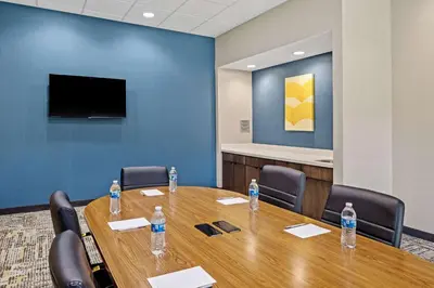a conference room with a table and chairs with water bottles at Hampton Inn & Suites Cincinnati West, Oh in Dent