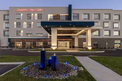 a hotel building with a sculpture in front of it at Hampton Inn & Suites Cincinnati West, Oh in Dent