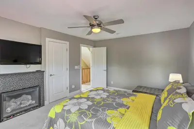a bedroom with a bed and a fireplace at Central Cleveland Gem with Direct Skyline View! in Cleveland