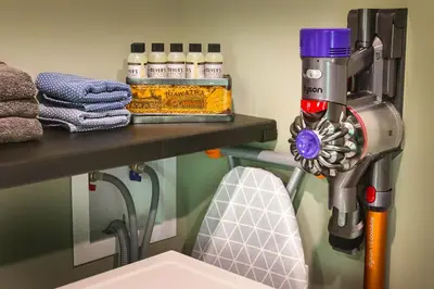 a cleaning machine on a shelf next to a toilet at Modern Industrial Farmhouse - The Wayback in Orange