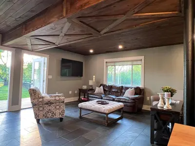 a living room with a couch and a table at Modern Industrial Farmhouse - The Wayback in Orange