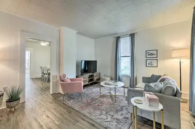 a living room with a couch and a tv at Pet-Friendly Greenville Home with Private Yard in Greenville