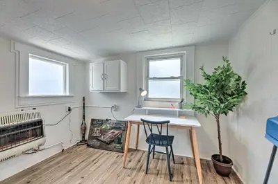 a kitchen with a table and a plant in a room at Pet-Friendly Greenville Home with Private Yard in Greenville