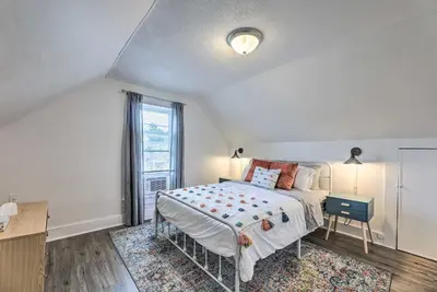 a bedroom with a bed and a window at Pet-Friendly Greenville Home with Private Yard in Greenville