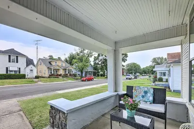a porch with a couch and chairs on a street at Pet-Friendly Greenville Home with Private Yard in Greenville