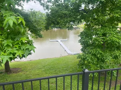 a river with a dock in the middle of it at Lakefront for 8, Near KY Speedway, Belterra Casino in Sparta