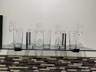 a glass table with many empty glasses on it at Uber Close to Ohio City, Cleveland (Lower) in Cleveland