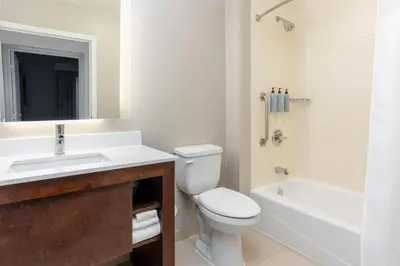 a bathroom with a sink and a toilet and a bath tub at Residence Inn by Marriott Columbus Polaris in Columbus