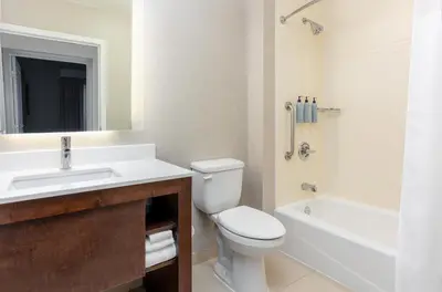 a bathroom with a sink and a toilet and a bath tub at Residence Inn by Marriott Columbus Polaris in Columbus