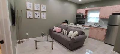 a living room with a couch and a table at Cozy Downtown Loft Apartment in Delaware