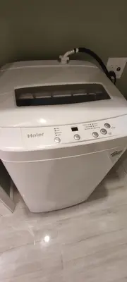 a white toaster sitting on a floor at Cozy Downtown Loft Apartment in Delaware