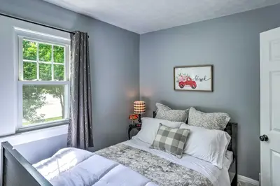 a bedroom with a bed and a window at Bright Parma Home with Outdoor Space Less Than 10 Mi to Dtwn in Parma