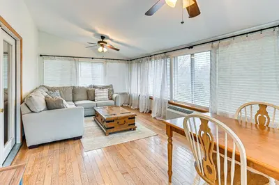 a living room with a couch and a table at Williamstown Gem with Private Pool and Hot Tub! in Williamstown