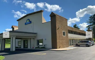 a building with a car parked in front of it at Days Inn by Wyndham Bellville Mansfield in Bellville