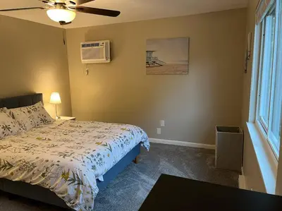 a bedroom with a bed and a ceiling fan at Carter #1 Two bedroom unit near Xavier Downtown in Cincinnati