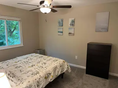a bedroom with a bed and a ceiling fan at Carter #1 Two bedroom unit near Xavier Downtown in Cincinnati
