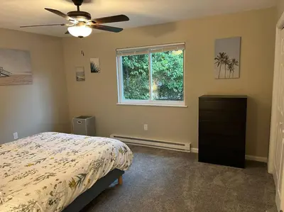 a bedroom with a bed and a ceiling fan at Carter #1 Two bedroom unit near Xavier Downtown in Cincinnati