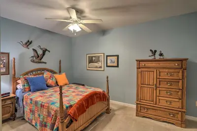 a bedroom with a bed and a ceiling fan at Cheerful Tiffin Digs in the Heart of Downtown in Tiffin