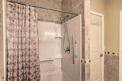 a bathroom with a shower with a shower curtain at Cheerful Tiffin Digs in the Heart of Downtown in Tiffin