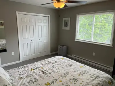 a bedroom with a bed and a ceiling fan at Carter #3 Two bedroom unit near Xavier Downtown in Cincinnati