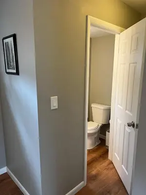 an empty bathroom with a toilet and a door at Carter #3 Two bedroom unit near Xavier Downtown in Cincinnati