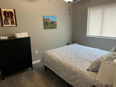 a bedroom with a bed and a dresser and a window at Carter #3 Two bedroom unit near Xavier Downtown in Cincinnati