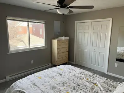 a bedroom with a bed and a ceiling fan at Carter #4 Two bedroom unit near Xavier Downtown in Cincinnati