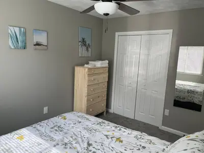 a bedroom with a bed and a dresser at Carter #4 Two bedroom unit near Xavier Downtown in Cincinnati