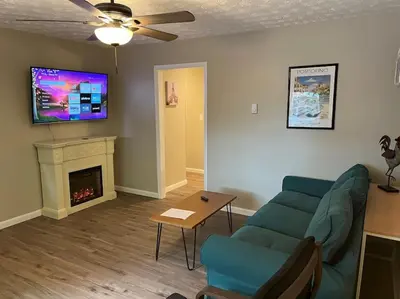 a living room with a couch and a fireplace at Carter #6 Two Bedroom Apartment near Xavier in Cincinnati