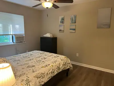 a bedroom with a bed and a ceiling fan at Carter #6 Two Bedroom Apartment near Xavier in Cincinnati