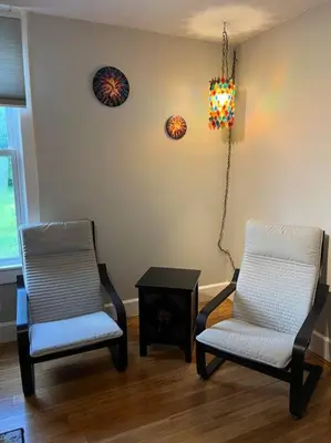 two chairs and a table in a living room at Main, Three Bedroom House in Historic Loveland in Loveland