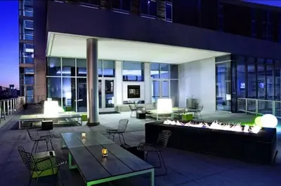 a lobby of a building with tables and chairs at Penthouse Loft In The Flats in Cleveland