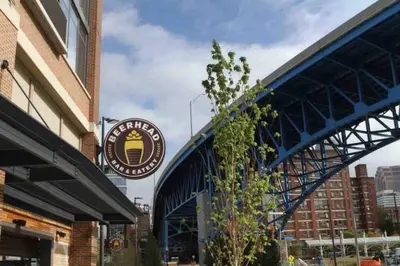 a building with a sign on the side of it at Penthouse Loft In The Flats in Cleveland