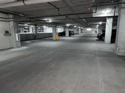 an empty parking garage with cars parked in it at Penthouse Loft In The Flats in Cleveland