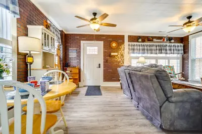 a kitchen and dining room with a table and chairs at Quaint Mt Vernon Cottage Near Historic Dtwn! in Mount Vernon